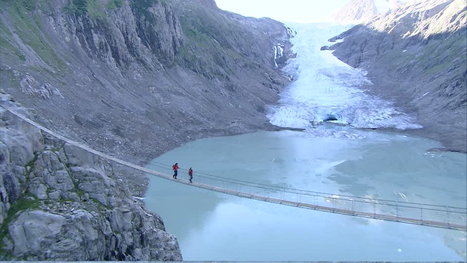 Crossing the Trift Suspension Bridge in the Swiss Alps: